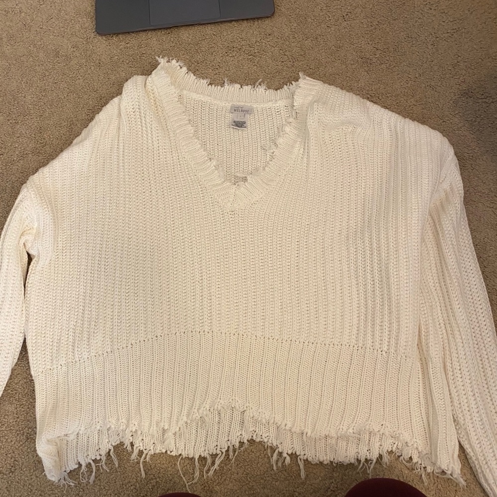 White fringed sweater